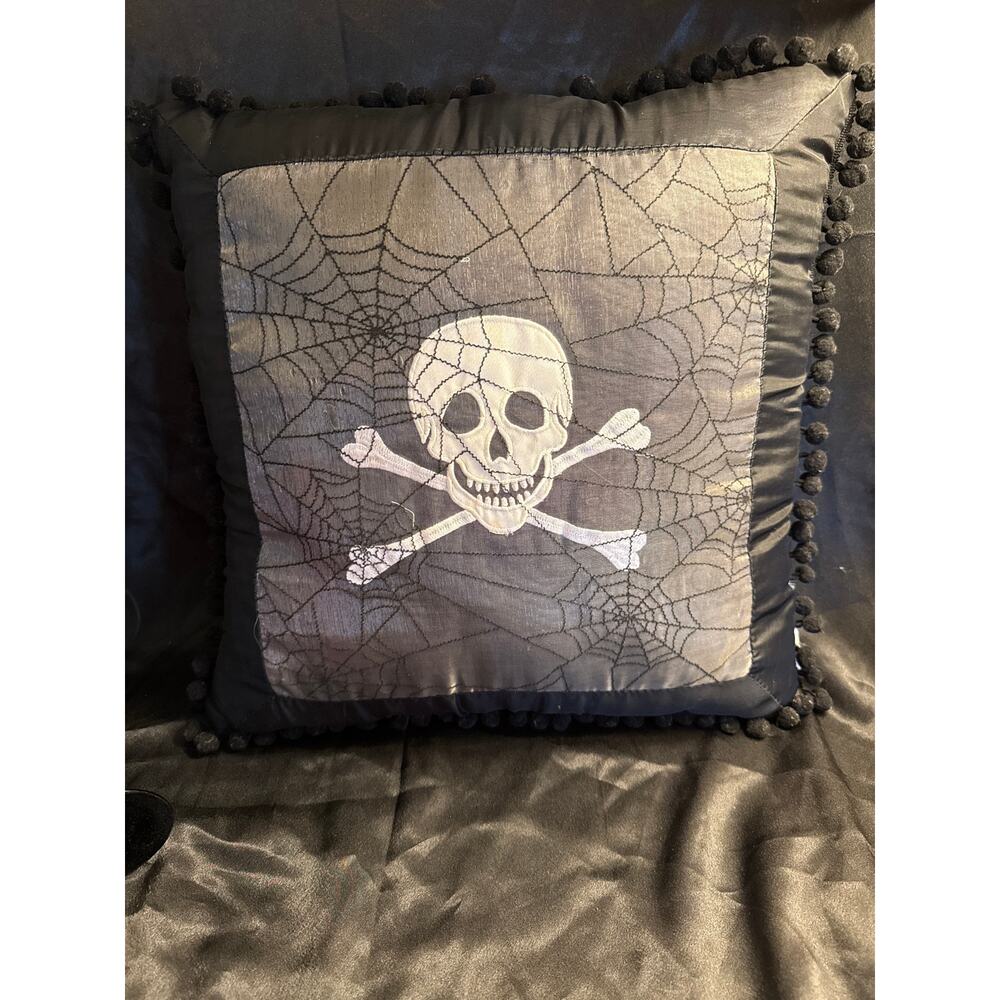 Skull and crossbones spiderwebs Satin throw pillow Pom-pom trim 15 x 15”